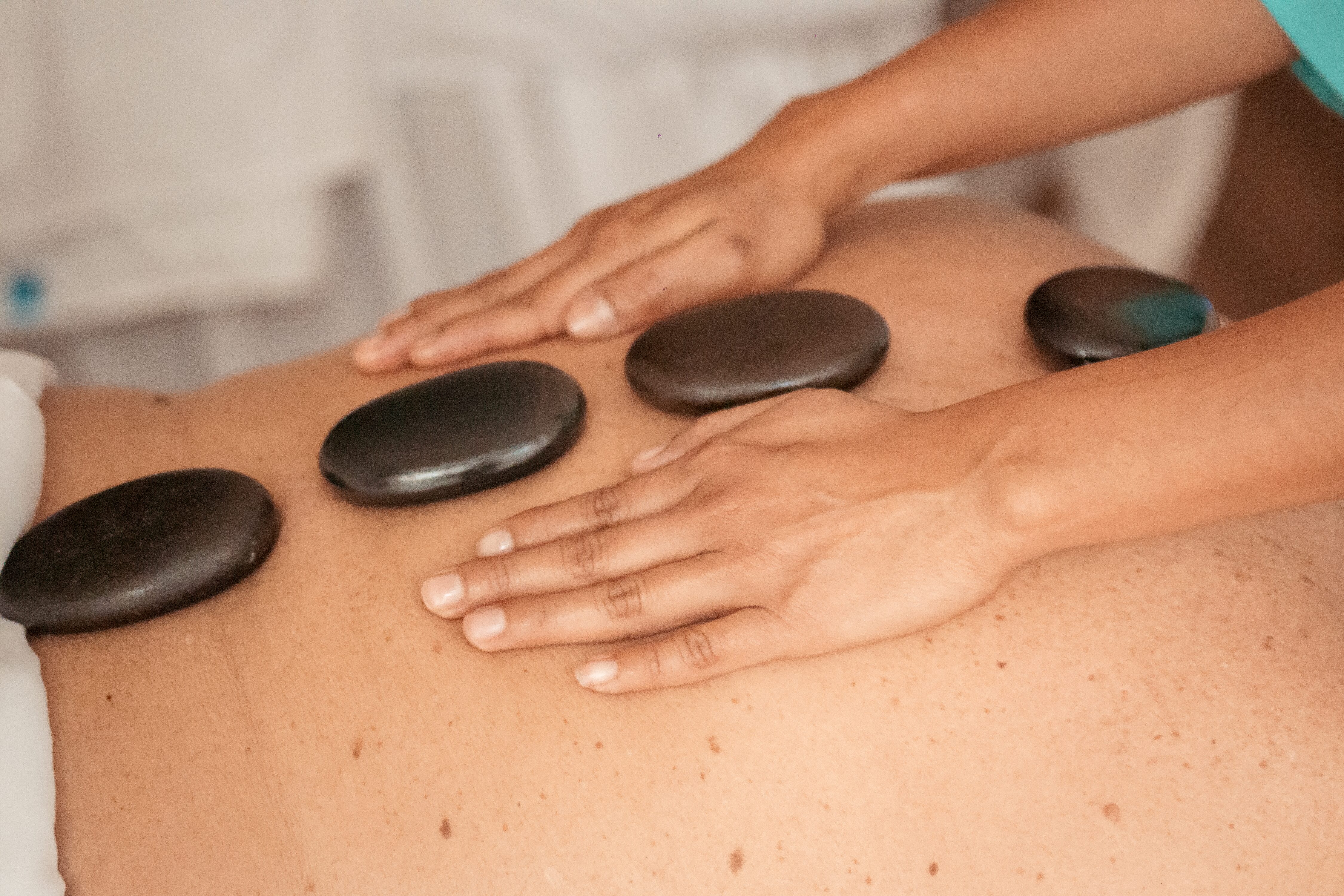 Image of hot stone massage at Azul Spa of Villa La Valencia in Cabo San Lucas, Mexico